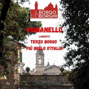 a view of a building with a clock tower at A&M House in Vignanello