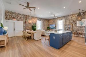 a kitchen and dining room with a brick wall at Harbor House Penthouse- B in Key West