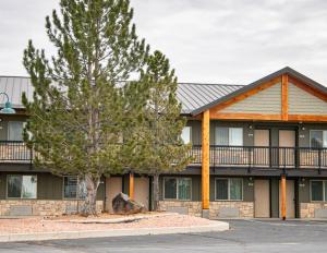 a building with a tree in front of it at Bryce View Lodge Part of the Ruby's Inn Resort in Bryce Canyon