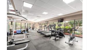 a gym with treadmills and elliptical machines at Comfortable 1 Bed 1 Bath Loft in Uptown Denver in Denver