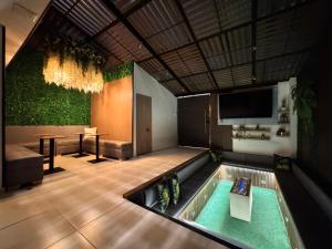 a room with a pool in the middle of a room at Santa Barbara Central Suites in Bogotá