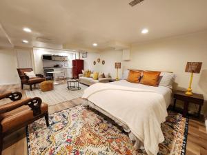 a bedroom with a large bed and a living room at Starlight Guesthouse in West Orange +69 photos