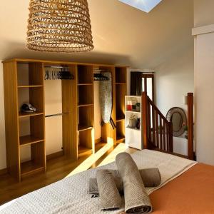 a bedroom with a bed and a chandelier at Echappée Bleue in Auvers-sur-Oise +13 photos