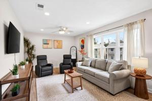 a living room with a couch and two chairs at The Porter Chamber in Ocean Springs