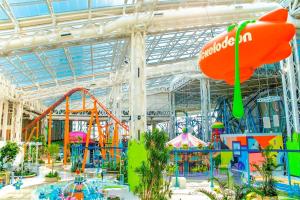 a large indoor water park with a roller coaster at Starlight Guesthouse in West Orange