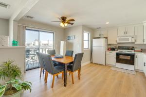 a kitchen with a table and chairs and a refrigerator at Relax Poolside! Lake-View Retreat in Osage Beach in Osage Beach