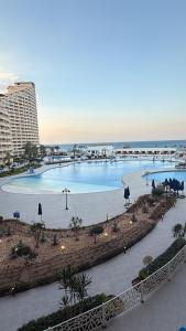 a view of a swimming pool at a resort at Porto Sokhna Aprtment Pool View - MR in Ain Sokhna