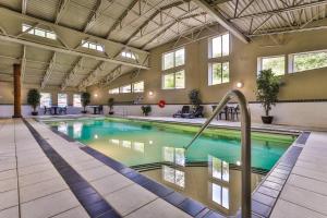 a large swimming pool in a large building at Silver Rock by StayIn in Fernie