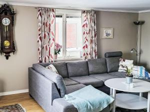 a living room with a couch and a table at Villa Äppelgården by Interhome in Örebro