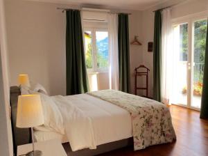 Posteľ alebo postele v izbe v ubytovaní Villa dei Fiori
