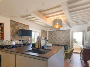 a kitchen with a sink and a counter top at Holiday Home Nobile by Interhome in Polveraia