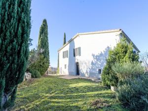 a white building with trees in front of it at Holiday Home Nobile by Interhome in Polveraia