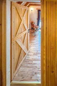a wooden door in a room with a hallway at Chalet Makov Hrib by Interhome in Tršće