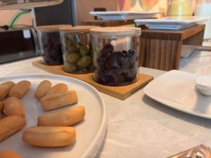 a table with a plate of food on a counter at Hotel La Posada de los Volcanes - ALTARA in Arequipa