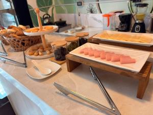 a counter with a bunch of food on a table at Hotel La Posada de los Volcanes - ALTARA in Arequipa +14 photos