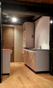 a kitchen with a sink and a counter in a room at TinyHome Texcoco in San Miguel Coatlinchán +11 photos