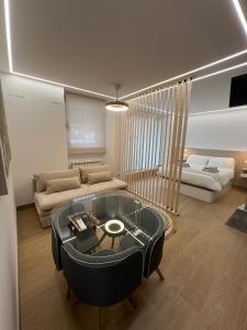 a living room with a couch and a table at El Doce Del Ferial in Solares