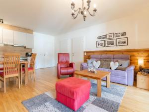 a living room with a couch and a table at Lungau Residence in Tamsweg