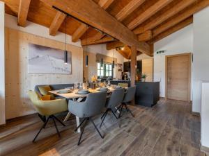 a dining room with a table and chairs at Wagrainer TauernLodge 42C in Wagrain +39 photos