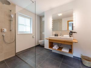 a bathroom with a sink and a shower at Wagrainer TauernLodge 42A in Wagrain +54 photos