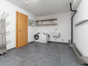 a laundry room with a washer and dryer at Wagrainer TauernLodge 42A in Wagrain