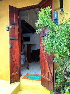 an open door to a room with a ladder at Casa Ametista in Lençóis