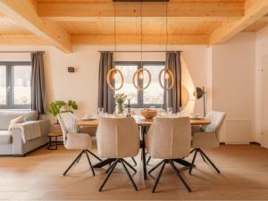 a dining room with a table and chairs at Obermöschach 5A in Obermöschach +55 photos