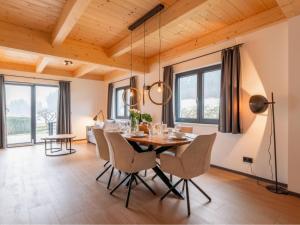 a dining room with a table and chairs at Obermöschach 5A in Obermöschach