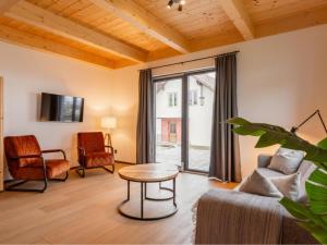 a living room with a couch and a table at Obermöschach 5A in Obermöschach