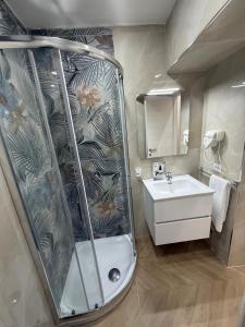 a bathroom with a shower and a sink at HV Carbonara 123 in Naples +58 photos