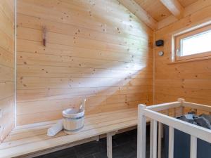 a wooden sauna with a bench and a window at Obermöschach 7A in Obermöschach +37 photos
