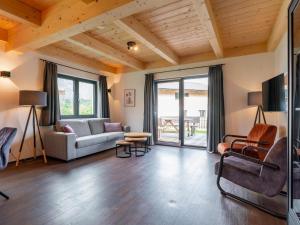 a living room with a couch and a table at Obermöschach 6B in Obermöschach