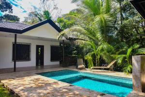 a pool in the backyard of a villa at Casa escondida in Uvita