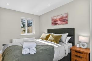 a bedroom with a large bed with towels on it at Martin Savage in Sligo