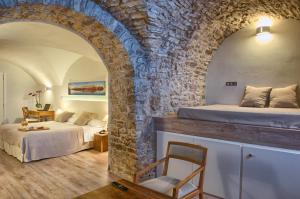 Postel nebo postele na pokoji v ubytování El Petit Convent