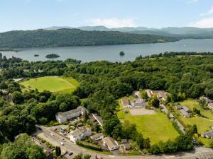 an aerial view of a house with a lake at Mylnebeck Lodge in Windermere