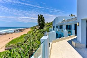 a house with a view of the beach at Villa Belle Mere Boutique Hotel in Sheffield Beach