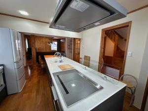 a kitchen with a sink and a counter top at Chalet Yutaka in Furano +6 photos