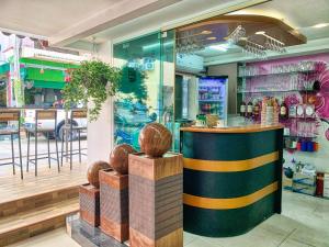 a store front with a counter in front of a store at Jomtien Beach Hostel - Soi 7 Prime Spot - 200m to Beach next to Food Market in Jomtien Beach
