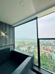 a room with a large window with a view at Lynntime in La Phu +8 photos