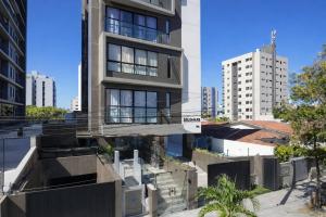 an aerial view of a building in a city at Flat PREMIUM em Manaíra - Sun Beach in João Pessoa