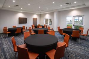 a room with round tables and chairs in a room at Holiday Inn Express & Suites Trinity by IHG in Trinity +75 photos