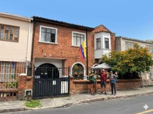a group of people standing in front of a building at Hostal CQ Chapinero in Bogotá