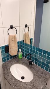 a bathroom counter with a sink and a mirror at Apto 3 dorms proximo a UFABC e CPTM in Santo André +22 photos