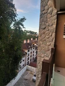 a view of a city from a balcony of a building at Brenthill Condo Ruby unit in Baguio