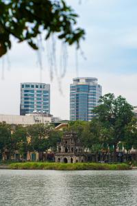 a city skyline with tall buildings in the background at Meliá Hanoi in Hanoi