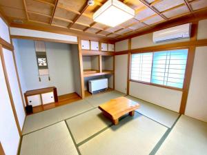 an empty room with a table in the middle of it at Luxury Villa N and N in Aomori +36 photos