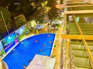 an overhead view of a swimming pool at a resort at Phong Dung Beach Hotel Phan Ri Cua in Tuy Phong +144 photos