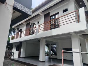 a house with a balcony in front of it at casita de flocerfida in Boac +17 photos