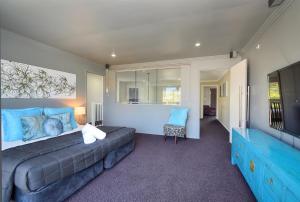 a bedroom with a large bed and a television at Bliss On Pearl Key in Gold Coast +14 photos
